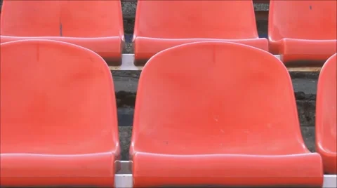 The camcorder is moving next to stadium chairs Stock Footage 48902039