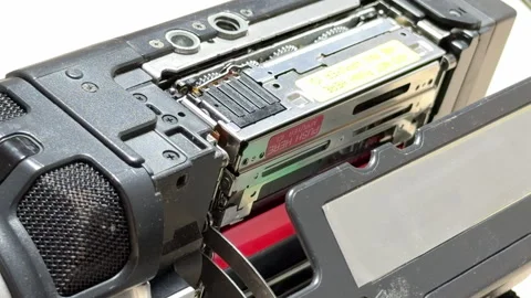 Camcorder Tape Deck Ejects with Mechanical Whir and Click Stock Footage 331057999