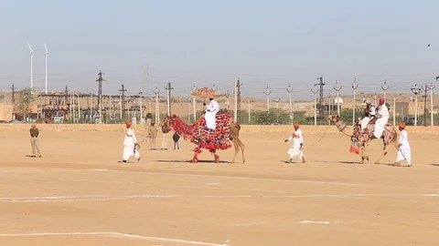 Camel and indian men in Desert Festival in Jaisalmer, Rajasthan, India Stock Footage