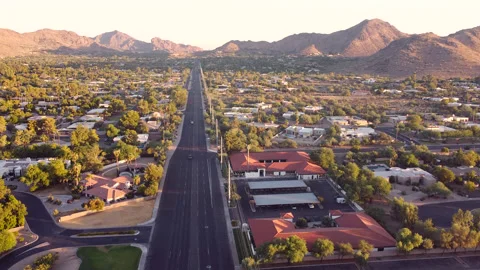 Camelback Mountain at Sunset overlooking Phoenix Arizona desert community. Stock Footage 135409131