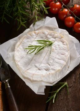 Camembert cheese on a rustic background Stock Photos