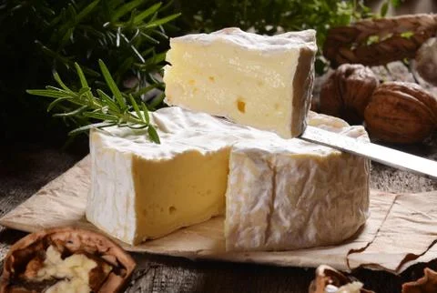 Camembert cheese on a rustic background Stock Photos