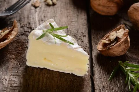 Camembert cheese on a rustic background Stock Photos
