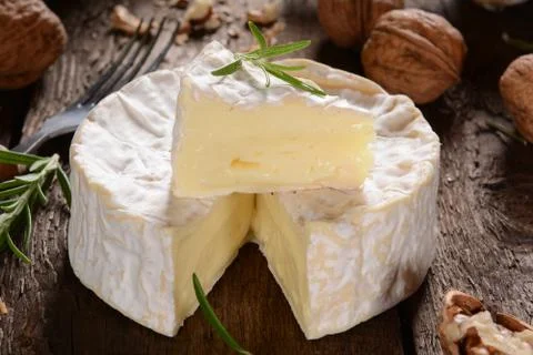 Camembert cheese on a rustic background Stock Photos