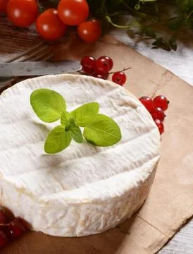Camembert cheese on a rustic background Stock Photos