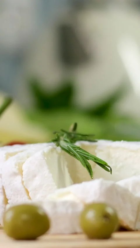 Camembert, Cooking process, Step by step worker at a craft cheese factory turns Stock Footage 303853926