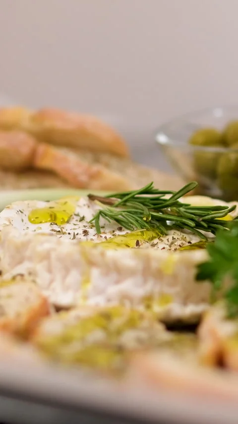 Camembert, Cooking process, Step by step worker at a craft cheese factory turns Stock Footage 303854246