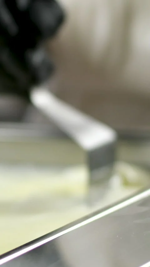 Camembert, Cooking process, Step by step worker at a craft cheese factory turns Stock Footage 306758624