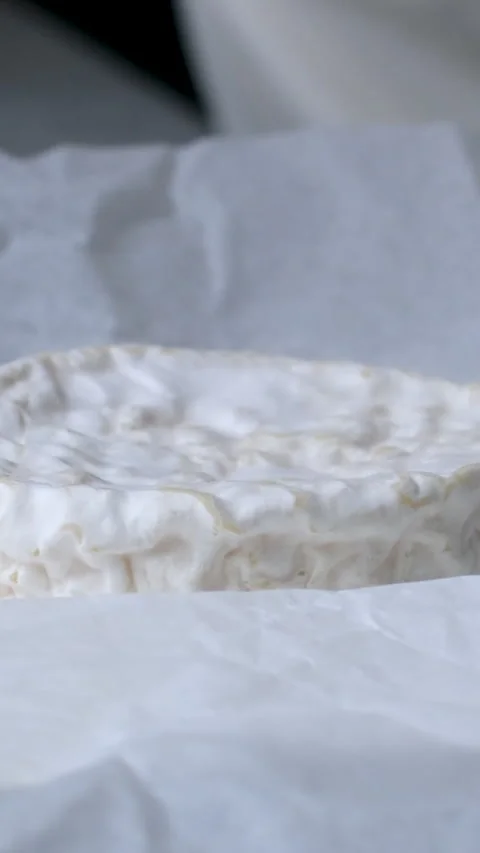 Camembert, Cooking process, Step by step worker at a craft cheese factory turns Stock Footage 306759040