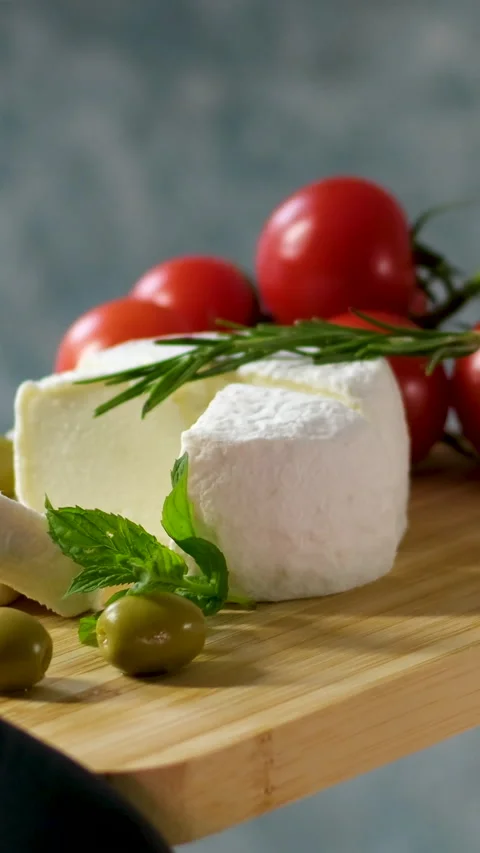 Camembert, Cooking process, Step by step worker at a craft cheese factory turns Stock Footage 306761233