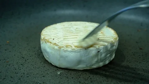 Camembert in a frying pan Stock Footage 111282842