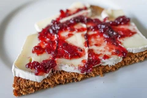 Camembert with Jam on Rustic Bread Stock Photos