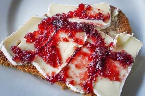Camembert with Jam on Rustic Bread Stock Photos