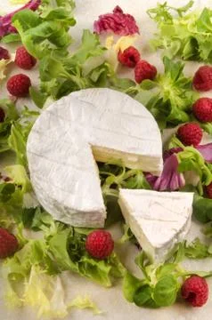 Camembert with raspberry and salad Stock Photos