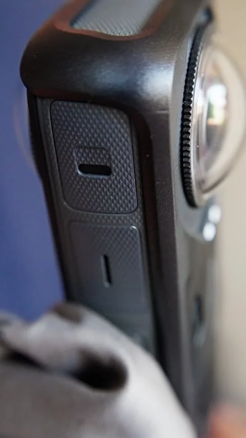 Camera 360 side view grip and button panel showing textured rubber, housing seam Stock-Footage 321612195