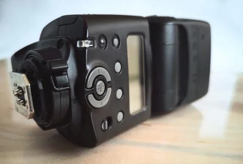 Camera accessories: modern on-camera flash. Presented close-up. Stock-Fotos