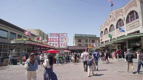 Camera Advances Toward Pike Place Market Entrance as Crowds Walk By Stock Footage 341338151
