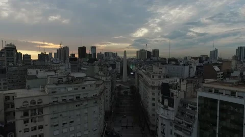 Camera aerial through Diagonal Norte Street with obelisk view at Buenos Aires Vídeo Stock 56233596