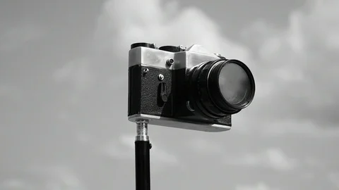 Camera against the sky, black and white Stock Footage 110844757