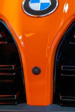 Camera ai sensor orange BMW M4 G82 Coupe, aerodynamic design, modern German.. Stock Photos