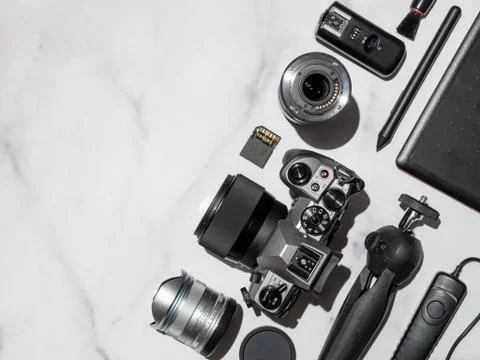 Camera and accessories on table, copy space 스톡 사진