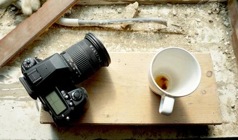 Camera and coffee cup Stock Photos