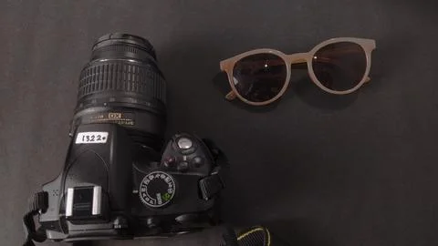 Camera and eyeglass Stock Photos