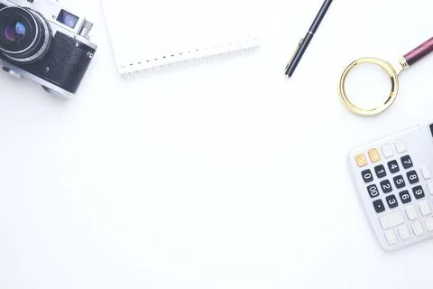 Camera and stationary on table Stock Photos