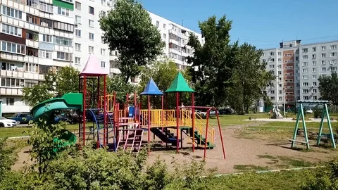 Camera approach to the Playground with a slide for children Stock Footage 93449130