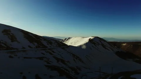 The camera approaches a mountain with snow. Winter Panorama, majesty and ice. N. Stock Footage 63480709