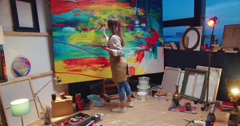 Camera approaching Caucasian young talented female artist working in own cozy Stock Footage 149578351