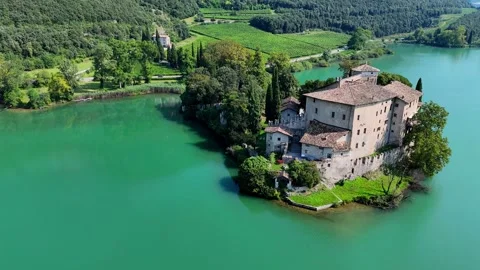 Camera approaching medieval castle on lake Stock Footage 283285947