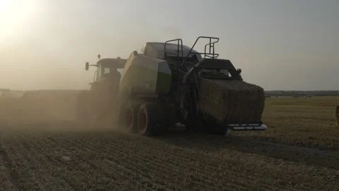 Camera around a combine with a haystack Stock Footage 141796819