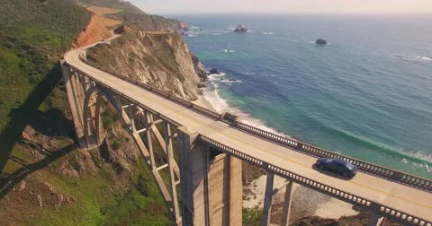 Camera ascending over Bixby Creek Bridge on PCH Highway 1 Stock Footage