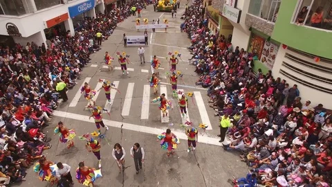 Camera Ascends Quickly from Over Parade Dancers Video stock 73023548