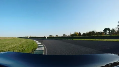 CAMERA ATTACHED TO THE BACK OF A SUPERCAR on a RACE circuit - sunny day 스톡 동영상 127414170