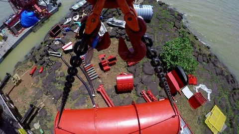 The camera is attached to a hook of a crane that moves a large red tanker. Stock Footage 71308193