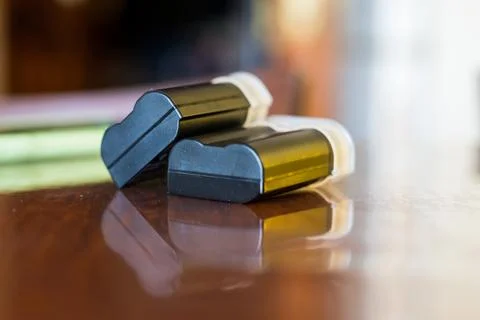 Camera batteries on the table Stock Photos