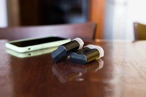 Camera batteries on the table Stock Photos