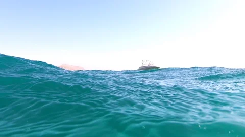 Camera being covered with waves multiple times in Red Sea Stockbeeldmateriaal 123380428