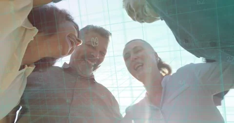 Camera below capturing four colleagues leaning stacking hands marking business Stock Footage 321715425
