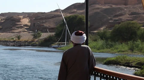 Camera boat - Dahabiya captain looking, Nile river, Egypt Stock Footage 35105980