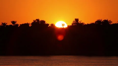 Camera boat - sunset behind the palms, Nile, Egypt Stock Footage 35112437