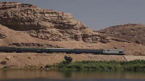 Camera boat - transit of a train on the Nile shores, Egypt Stock Footage 35092888