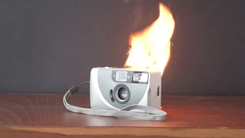 The camera burns with fire on the table, the battery ignites.  The cause of the  Video stock 170246647