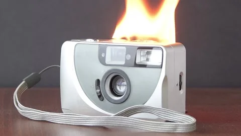 The camera burns with fire on the table, the battery ignites.  The cause of the  Stock Footage 170246662