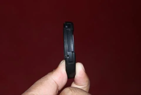 Camera cap one side view with red background. black colour camera cap. Stock Photos