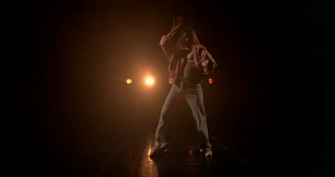 The camera captures a beautiful girl dancing hip-hop Stock Footage 150438667