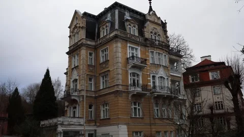 The camera captures a grand historic building with ornate balconies and detailed Stock Footage 300541317