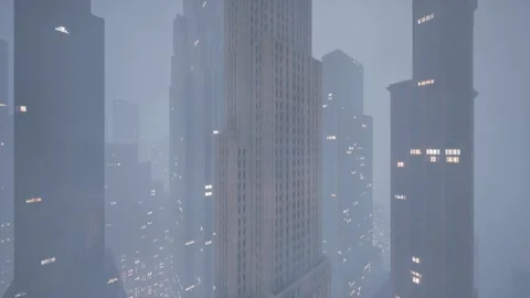 The camera captures a huge abandoned skyscraper in the center of a metropolis in Stock Footage 257392417